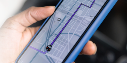 Hand holding phone with map