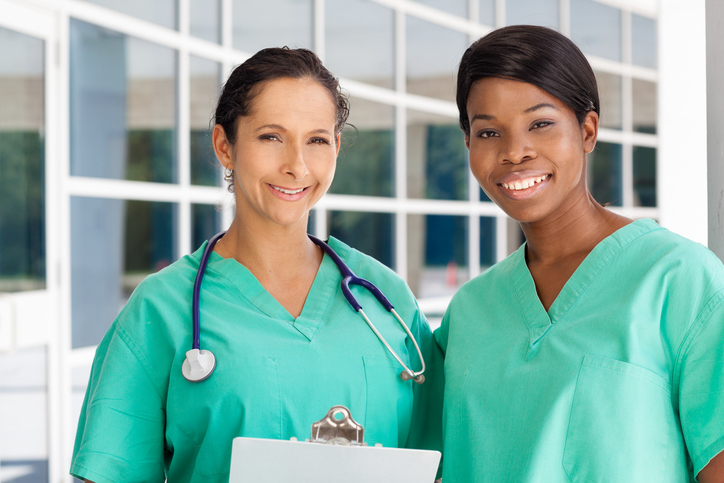 female nurses in light green scrubs 