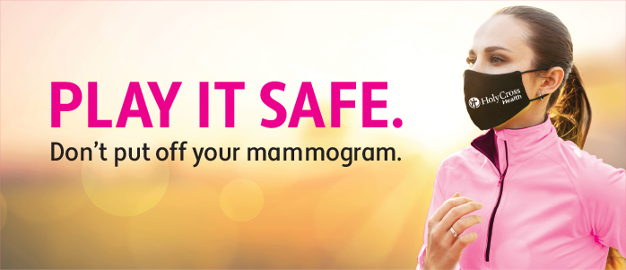 Masked woman in pink jacket